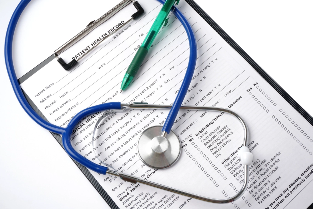 medical records sheet on a clip board with a stethoscope on top